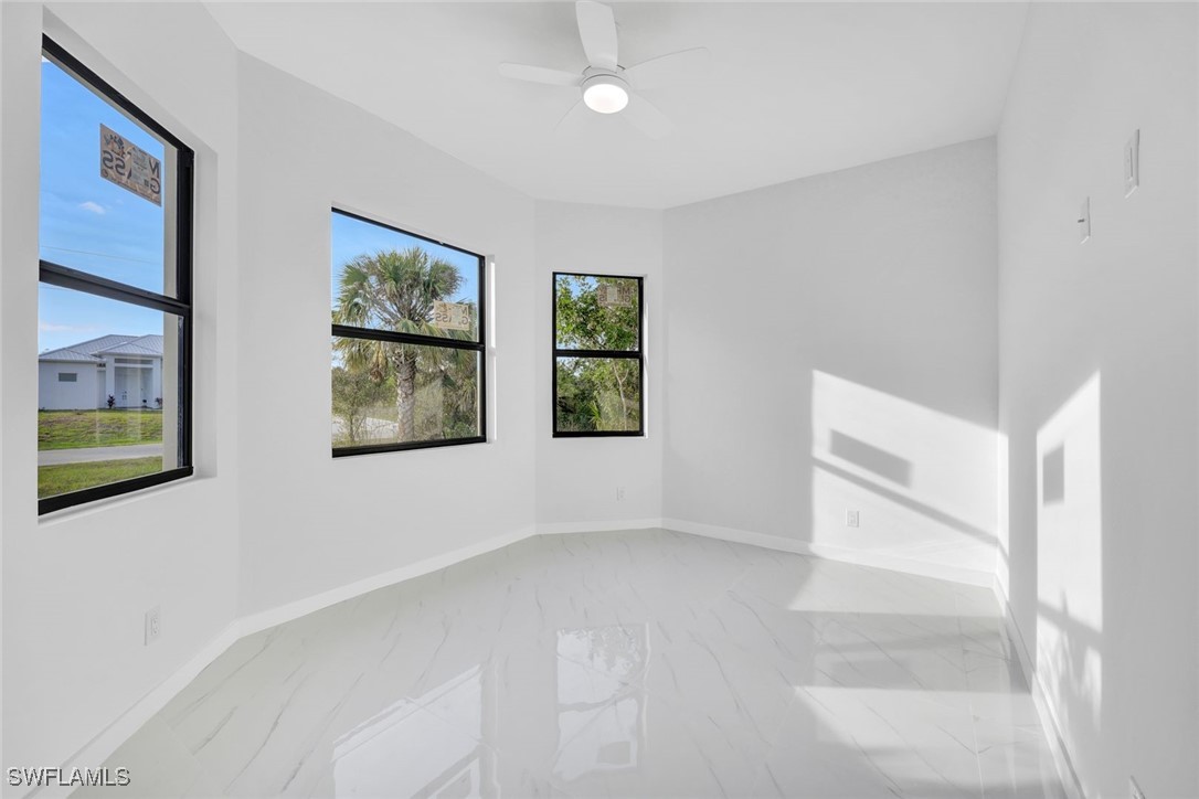 347 Ranch Avenue Lehigh Acres, FL 33974 - Photo 19 of 30 a view of an empty room with a window
