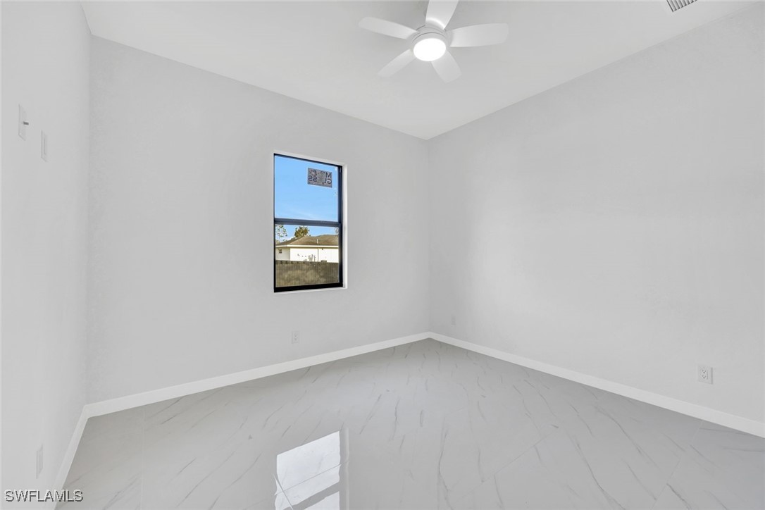 347 Ranch Avenue Lehigh Acres, FL 33974 - Photo 22 of 30 an empty room with a window