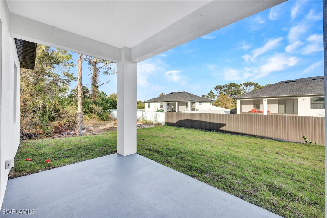 347 Ranch Avenue Lehigh Acres, FL 33974 - Photo 25 of 30 a view of a house with backyard and porch