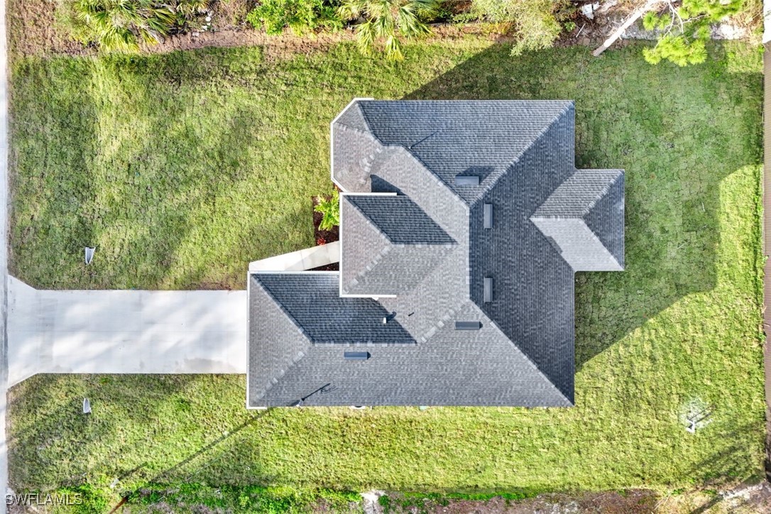 347 Ranch Avenue Lehigh Acres, FL 33974 - Photo 30 of 30 an aerial view of house with yard