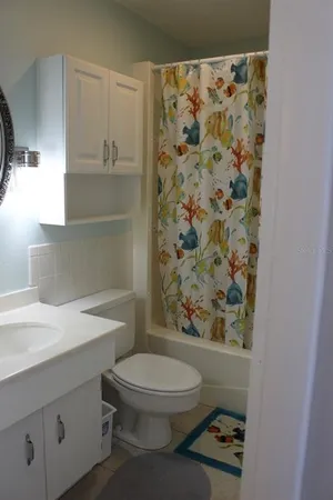 a bathroom with a toilet a sink and garden
