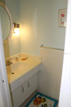 a bathroom with a sink and a mirror