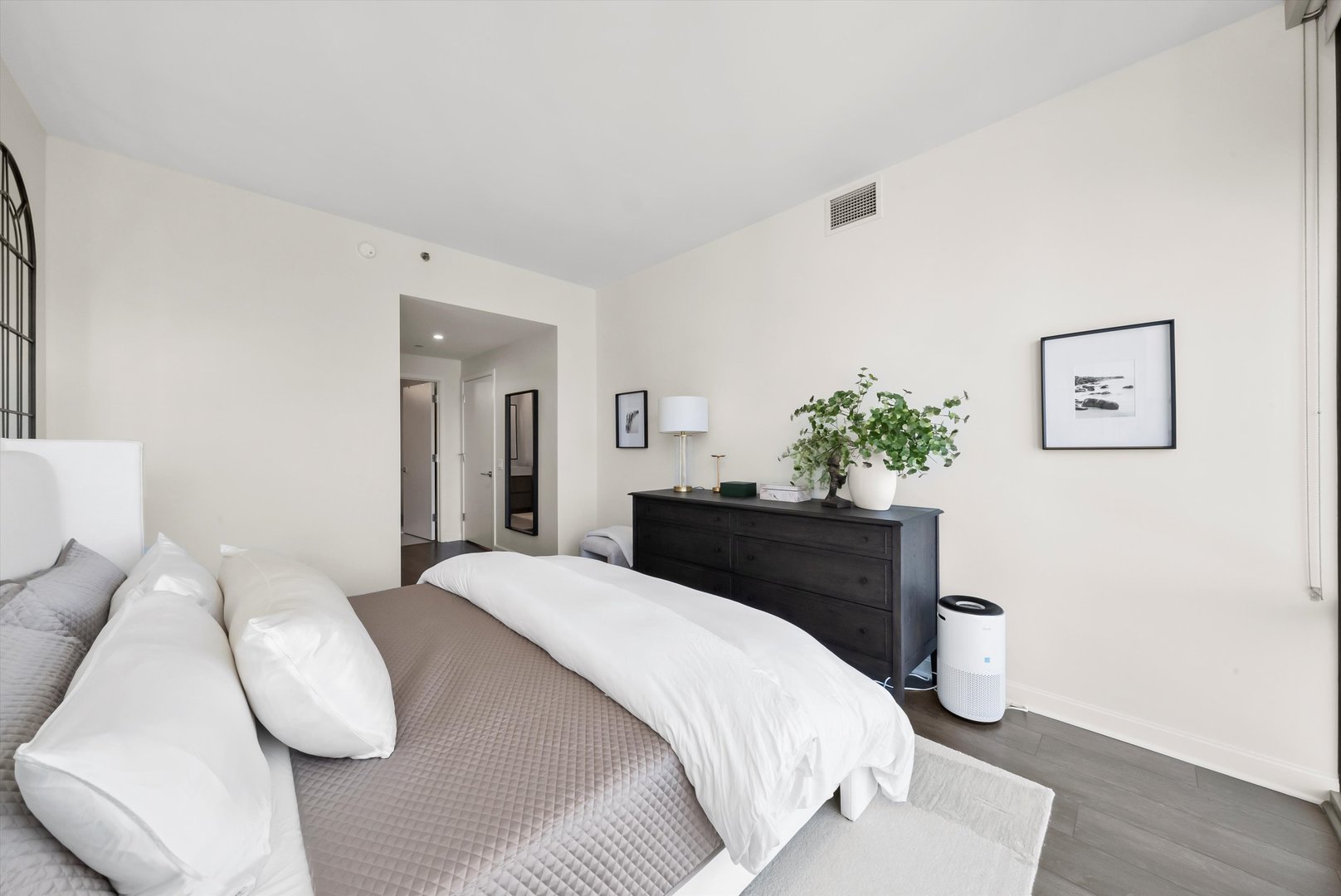 164 North Peoria Street, Unit 1705 Chicago, IL 60607 - Photo 11 of 33 a bedroom with a bed and painting on the wall