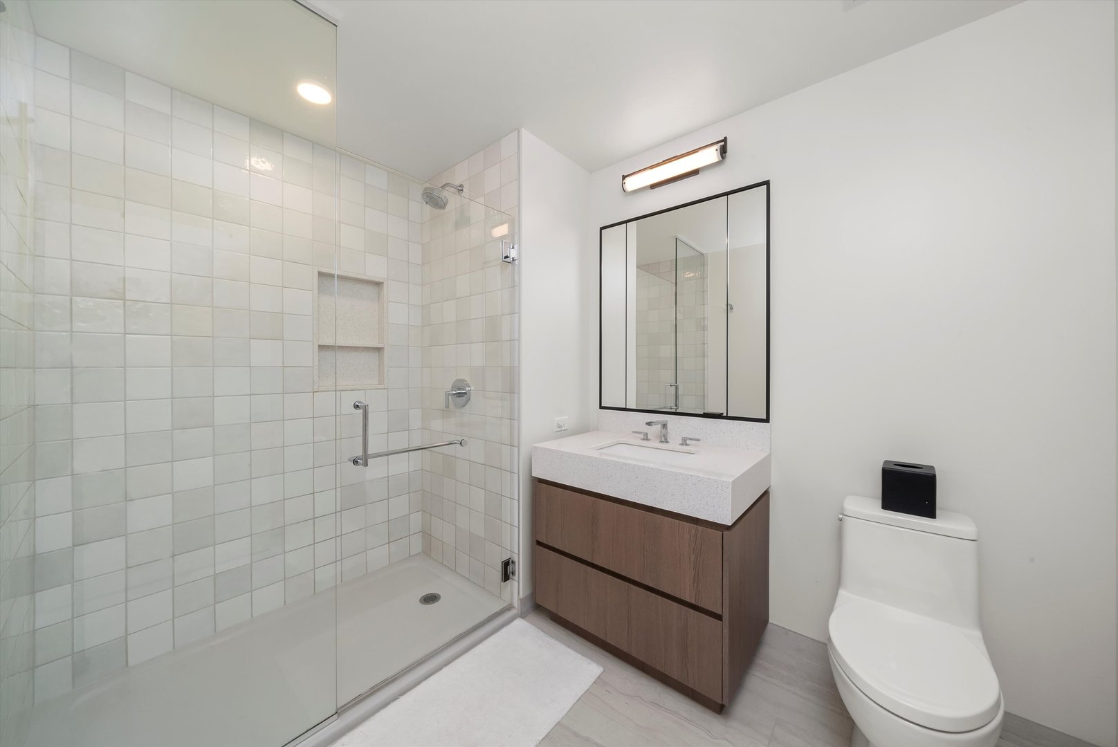 164 North Peoria Street, Unit 1705 Chicago, IL 60607 - Photo 12 of 33 a bathroom with a sink a toilet and shower