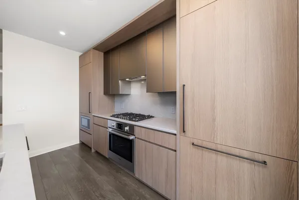 a kitchen with a stove and a refrigerator