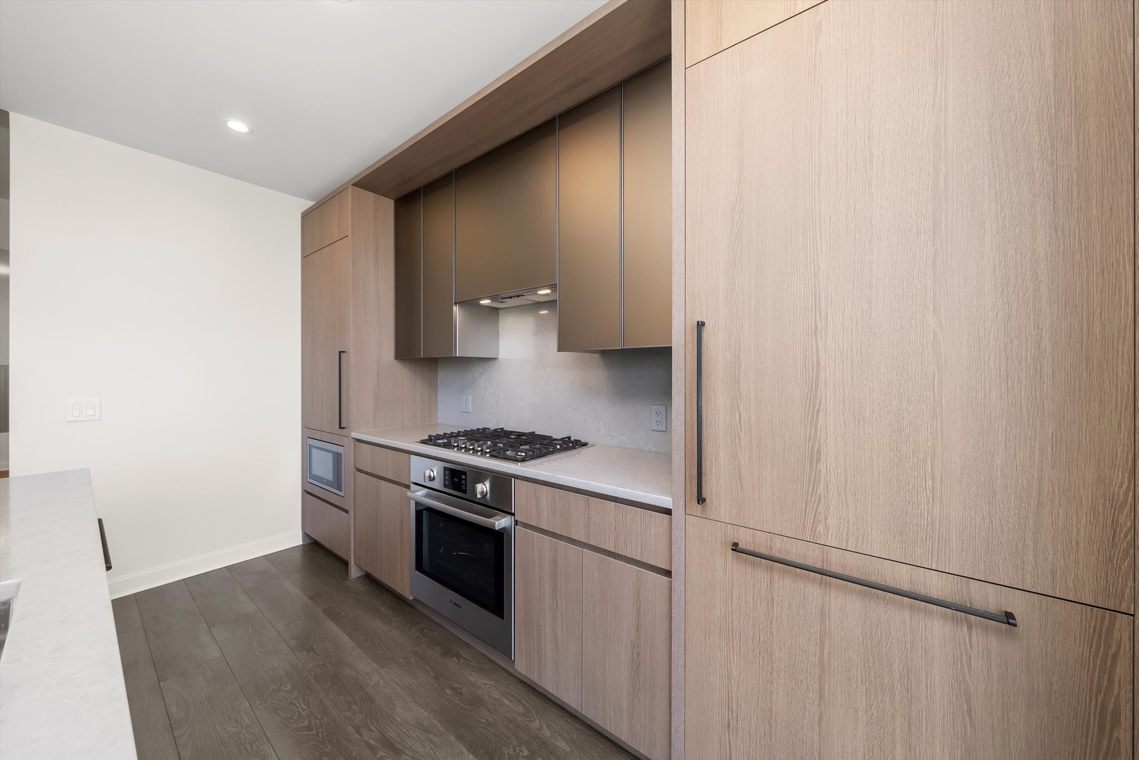 164 North Peoria Street, Unit 1705 Chicago, IL 60607 - Photo 20 of 33 a kitchen with a stove and a refrigerator