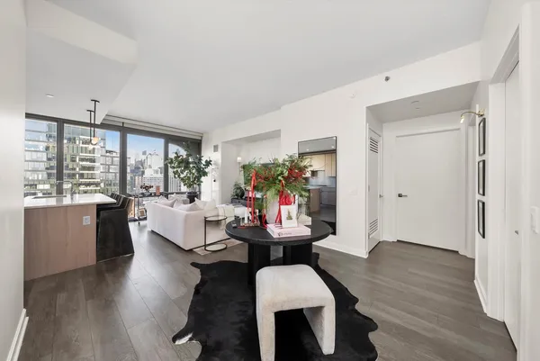 a view of a dining room with furniture and wooden floor
