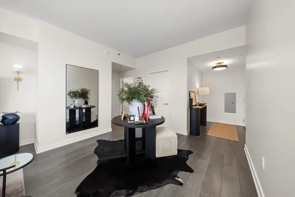 a living room with furniture and a potted plant