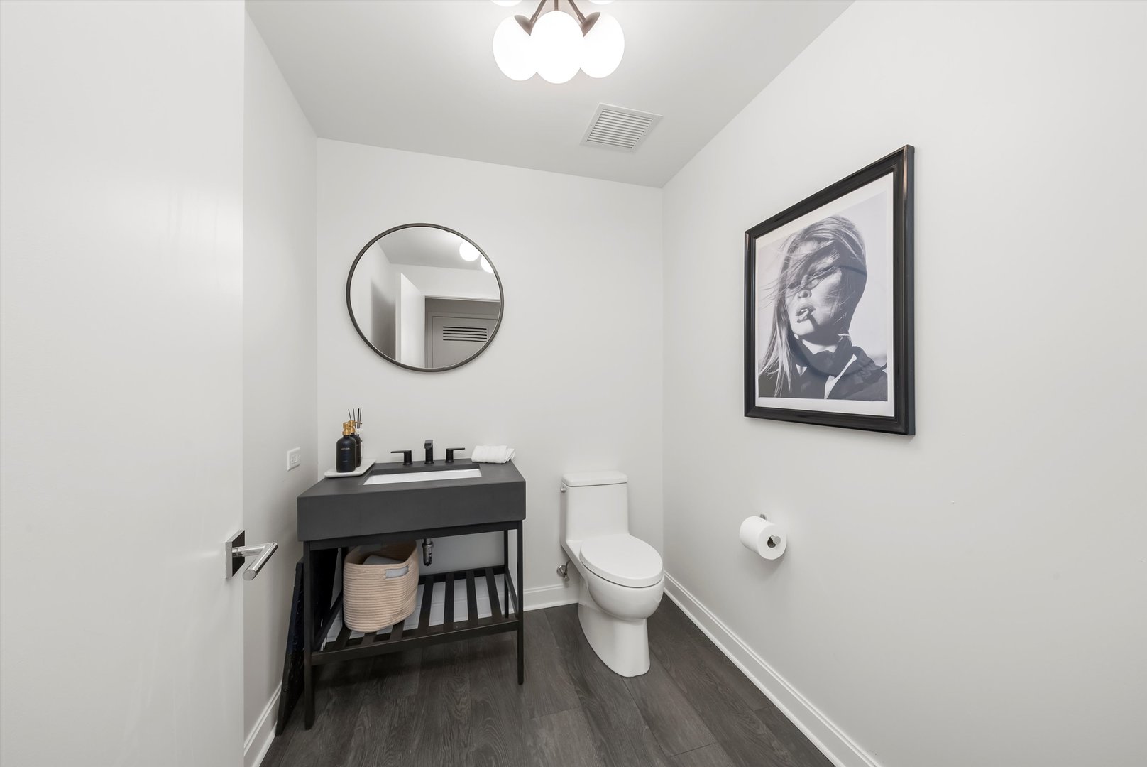 164 North Peoria Street, Unit 1705 Chicago, IL 60607 - Photo 23 of 33 a bathroom with a toilet a sink and mirror