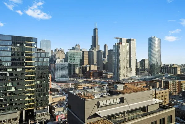 a view of city with tall buildings