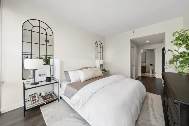 a bedroom with bed and a window