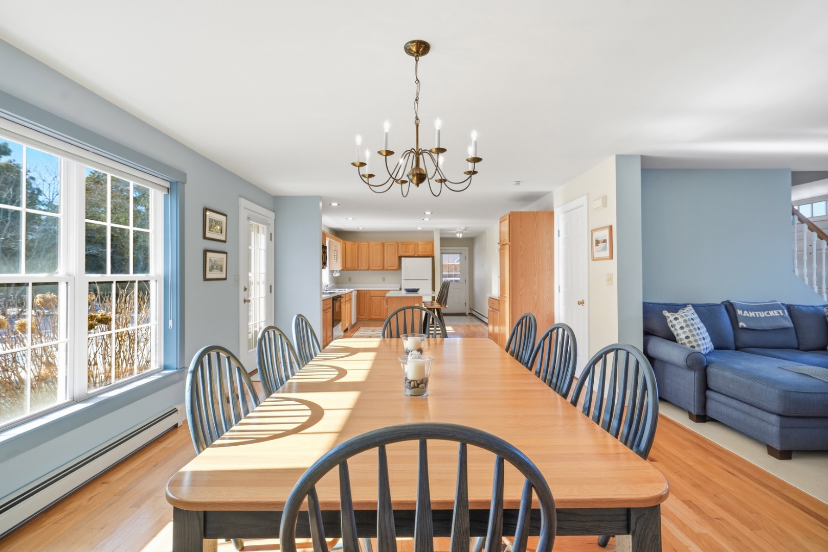 20 Rudder Lane Nantucket, MA 02554 - Photo 11 of 34 a dining room with furniture a chandelier and wooden floor