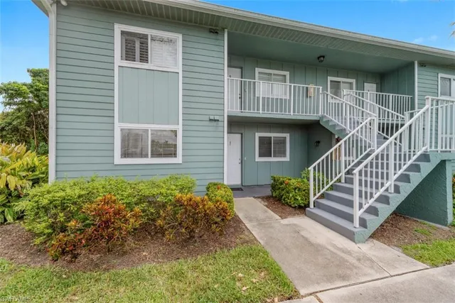 a front view of a house with garage