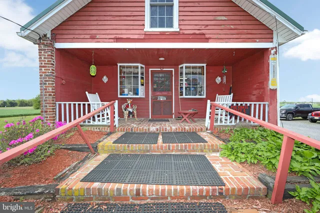 a view of a backyard with a garden and stairs