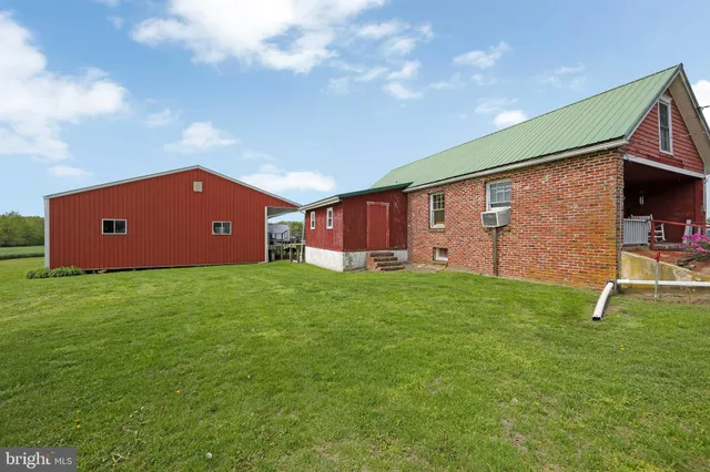 a view of a house with a yard and garage