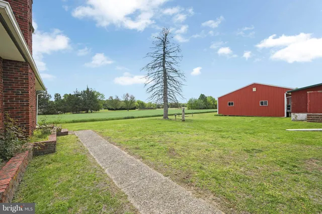 a view of couple of cars parked in parking area