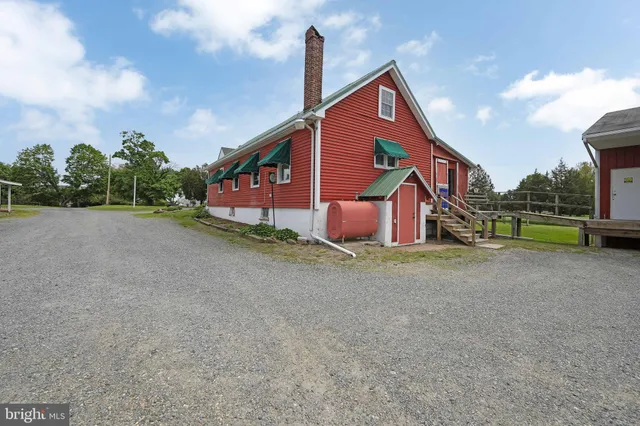 a living room with furniture rug and window
