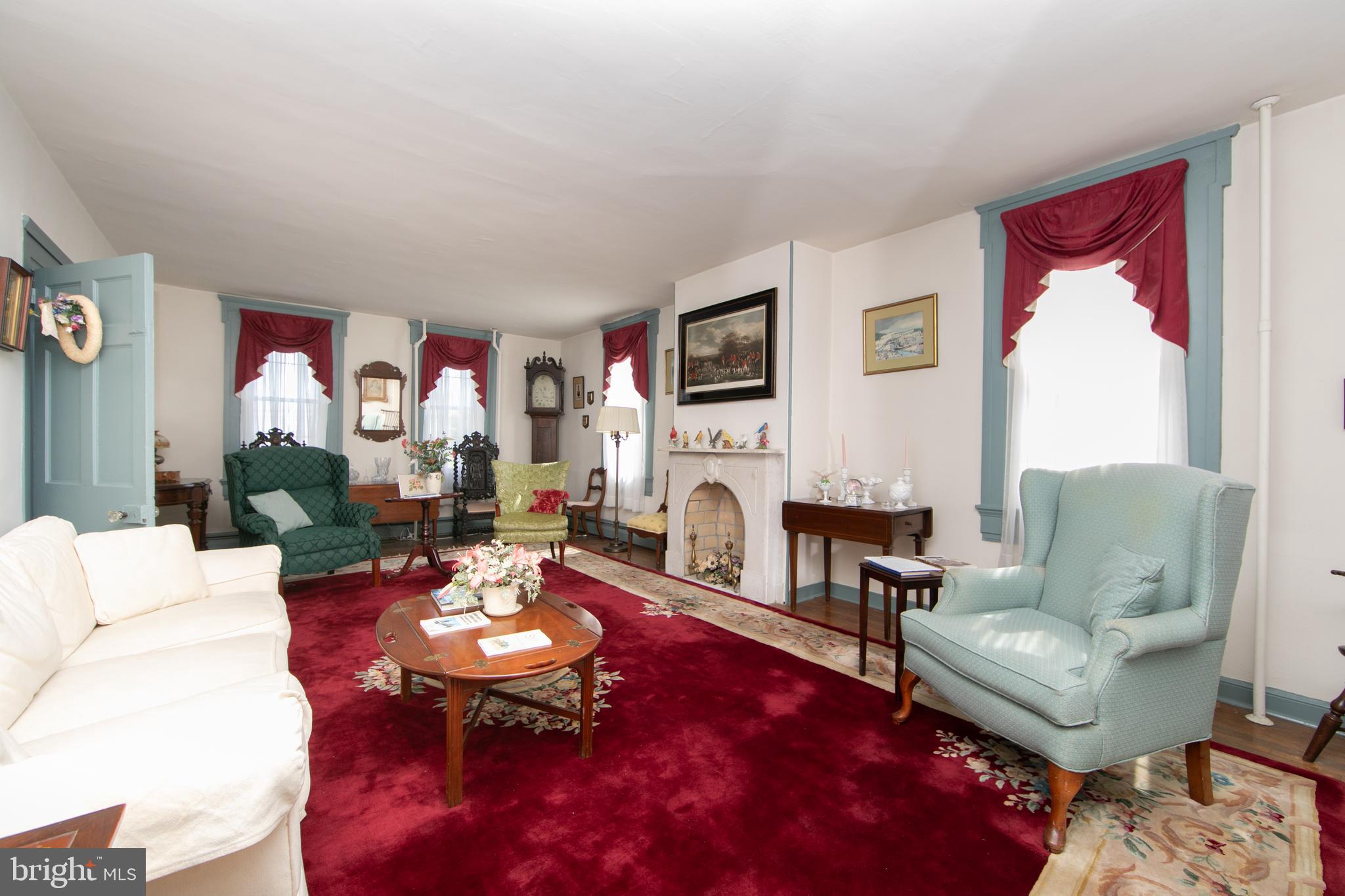 111 Newbolds Corner Road Southampton, NJ 08088 - Photo 33 of 96 a living room with furniture a fireplace and a flat screen tv