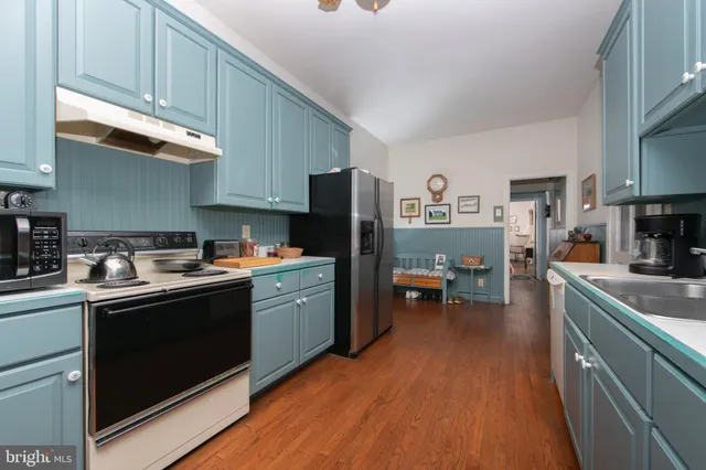 a view of a porch with a wooden fence