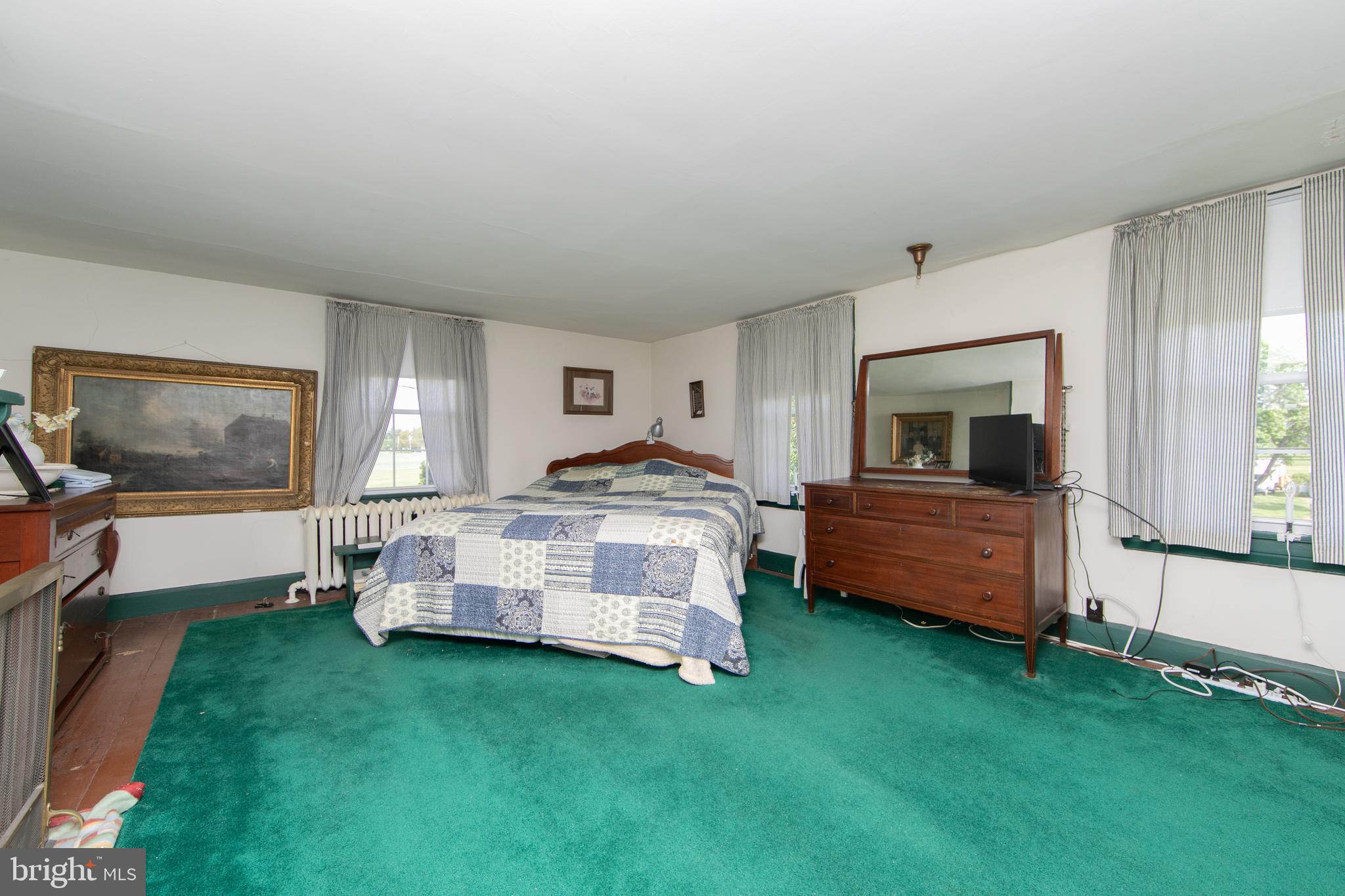 111 Newbolds Corner Road Southampton, NJ 08088 - Photo 51 of 96 a bedroom with a bed and a flat screen tv