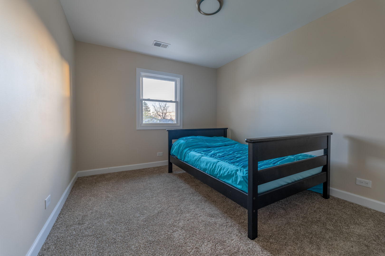 543 Rose Avenue Addison, IL 60101 - Photo 13 of 18 a bedroom with a bed and a window