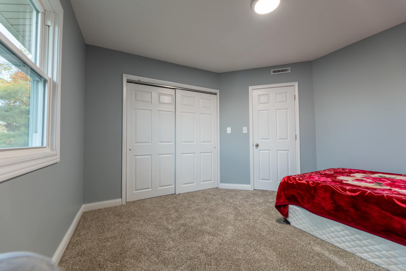 543 Rose Avenue Addison, IL 60101 - Photo 14 of 18 a bedroom with a bed and a window