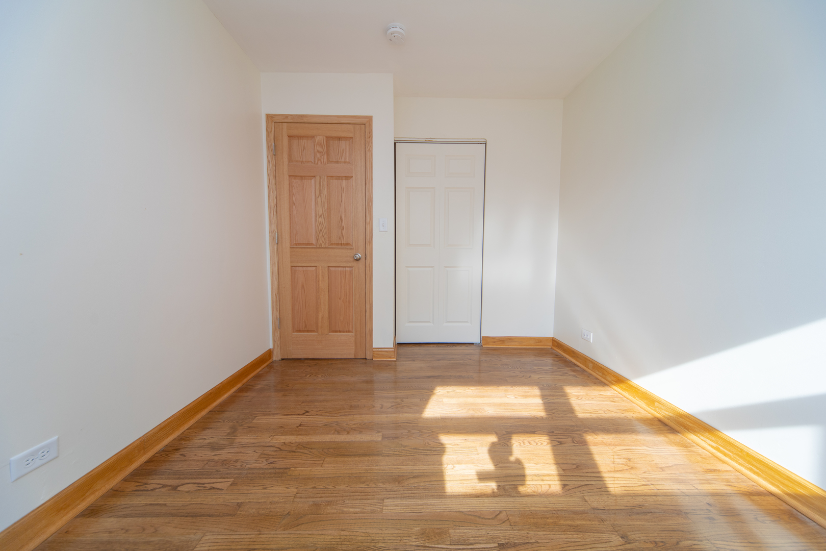 543 Rose Avenue Addison, IL 60101 - Photo 10 of 18 a view of an empty room and wooden floor