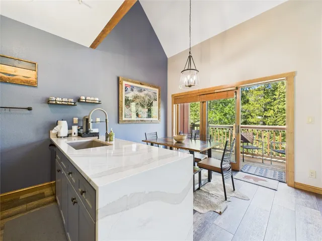 a view of a kitchen area with furniture and windows