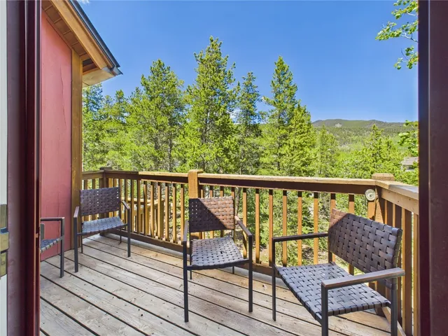 a view of a two chairs in the balcony