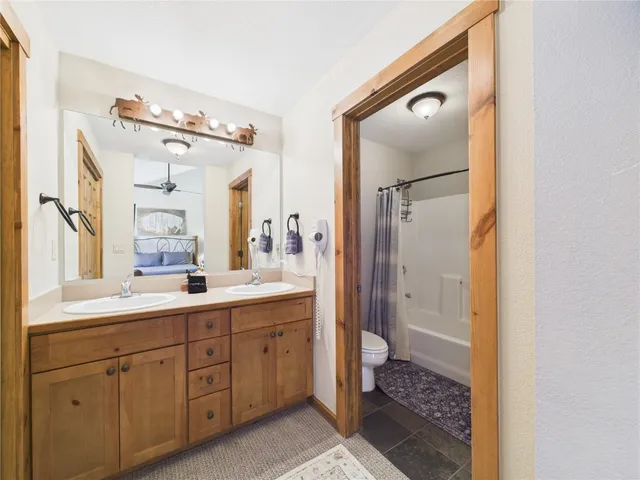 a bathroom with a sink a mirror and a shower
