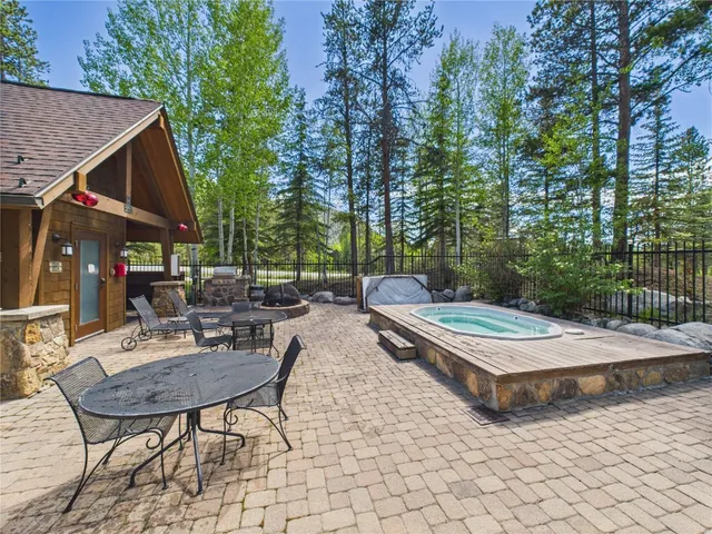 a view of house with backyard and furniture
