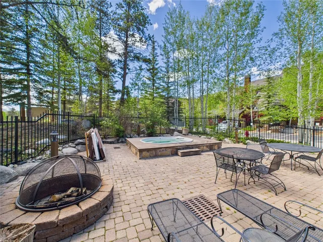 a view of a backyard with sitting area