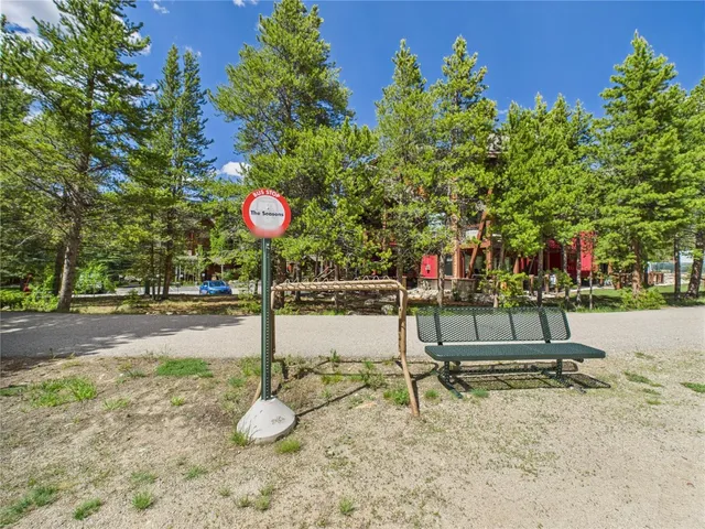 a table and chair sitting in the middle of a yard