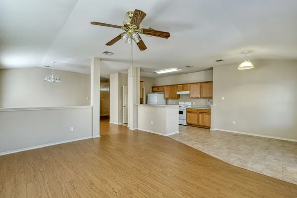 a view of a kitchen with a sink hardwood floor and a kitchen