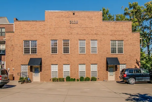a car parked in front of a building