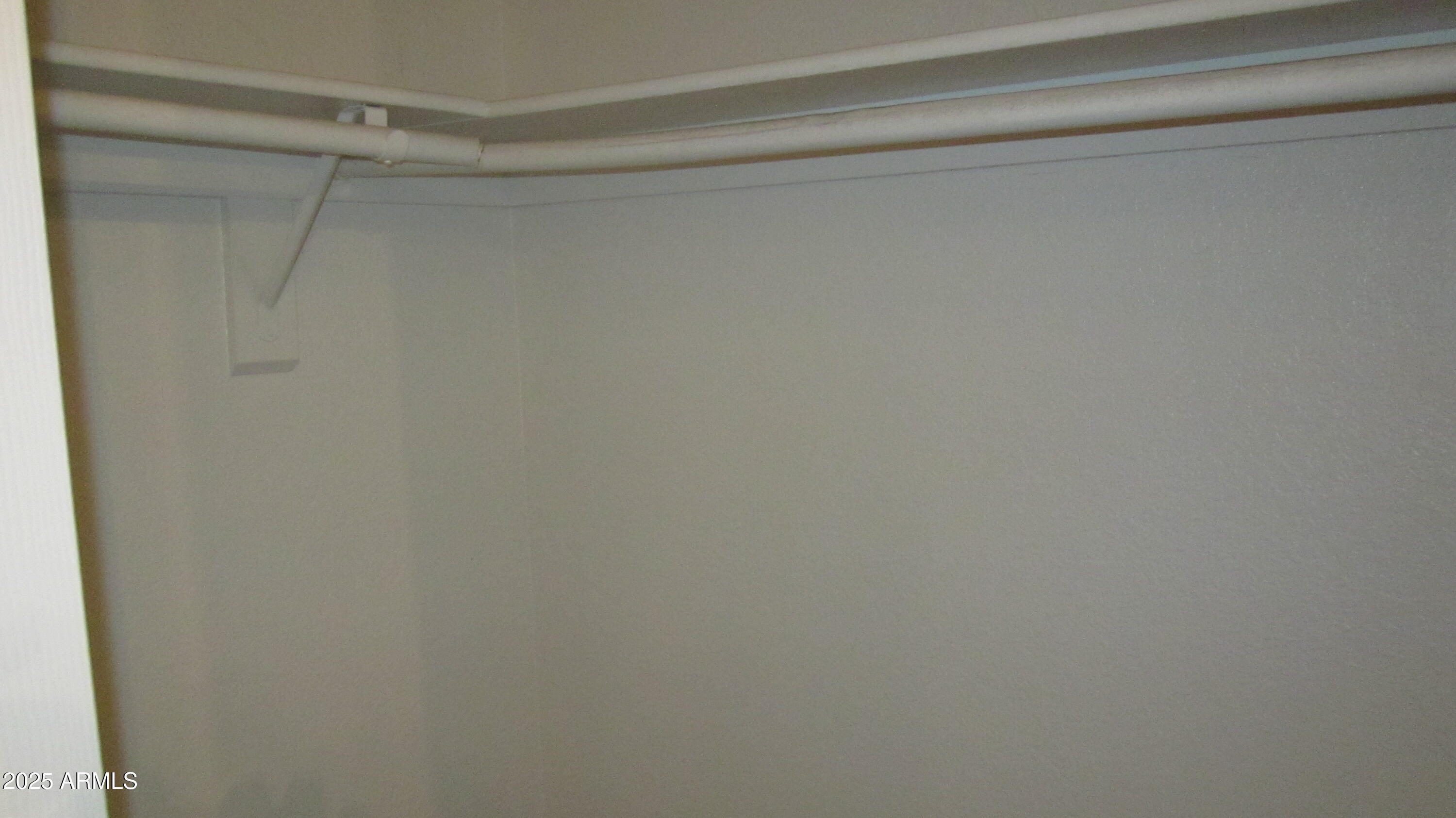 1340 North Recker Road, Unit 323 Mesa, AZ 85205 - Photo 11 of 13 a view of a rack on the wall