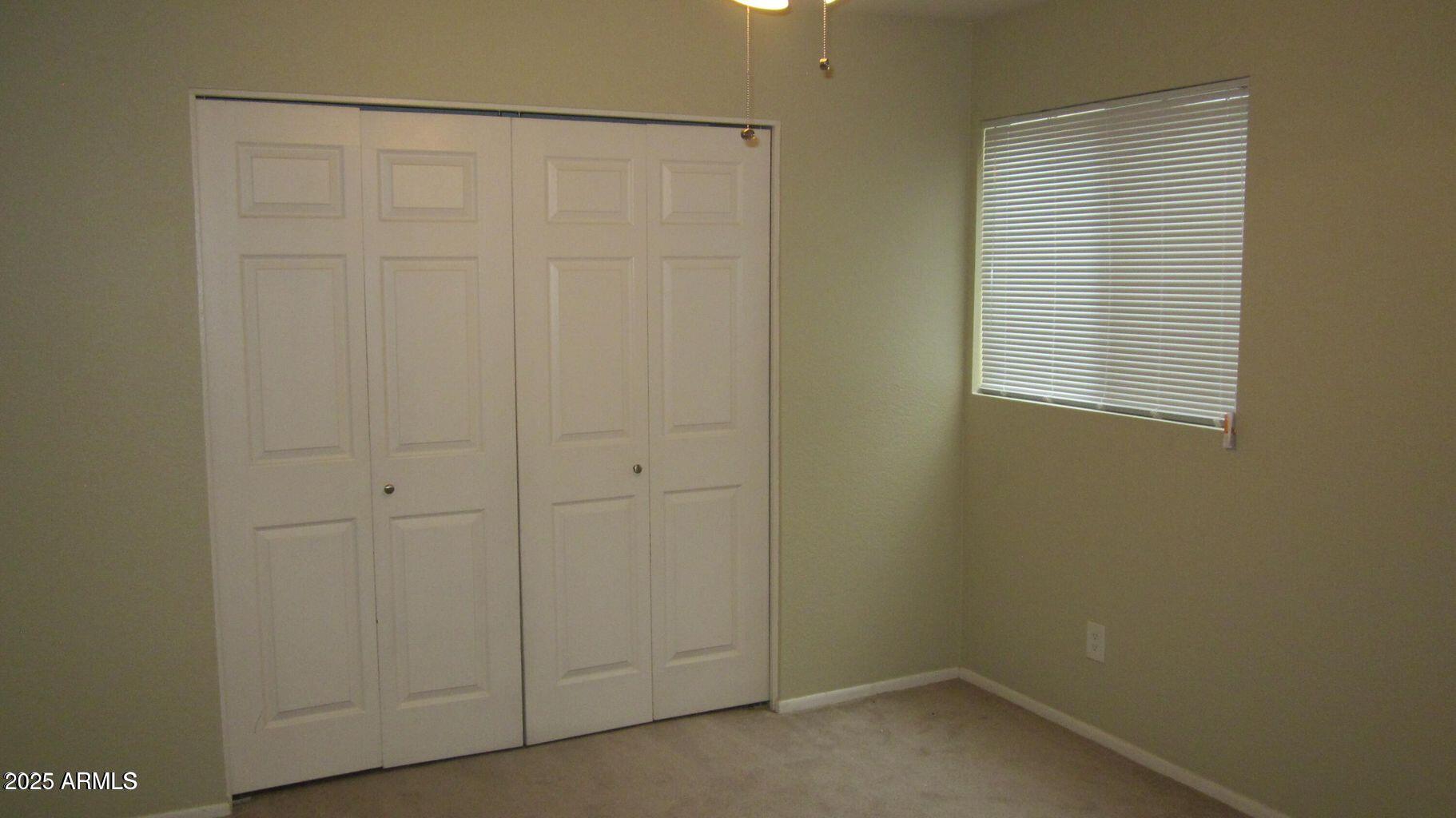 1340 North Recker Road, Unit 323 Mesa, AZ 85205 - Photo 12 of 13 a small space with a window