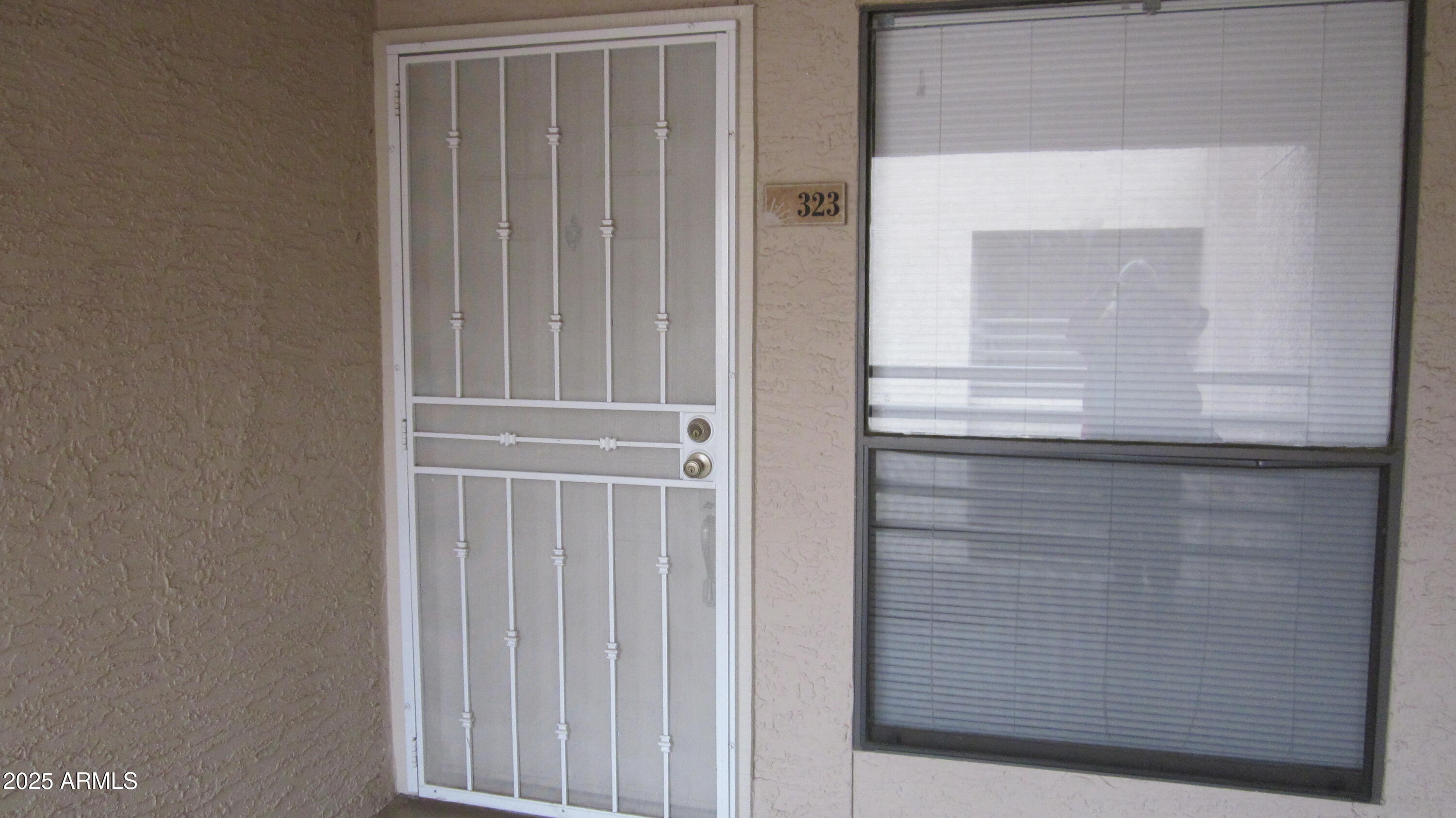 1340 North Recker Road, Unit 323 Mesa, AZ 85205 - Photo 3 of 13 a view of wooden door