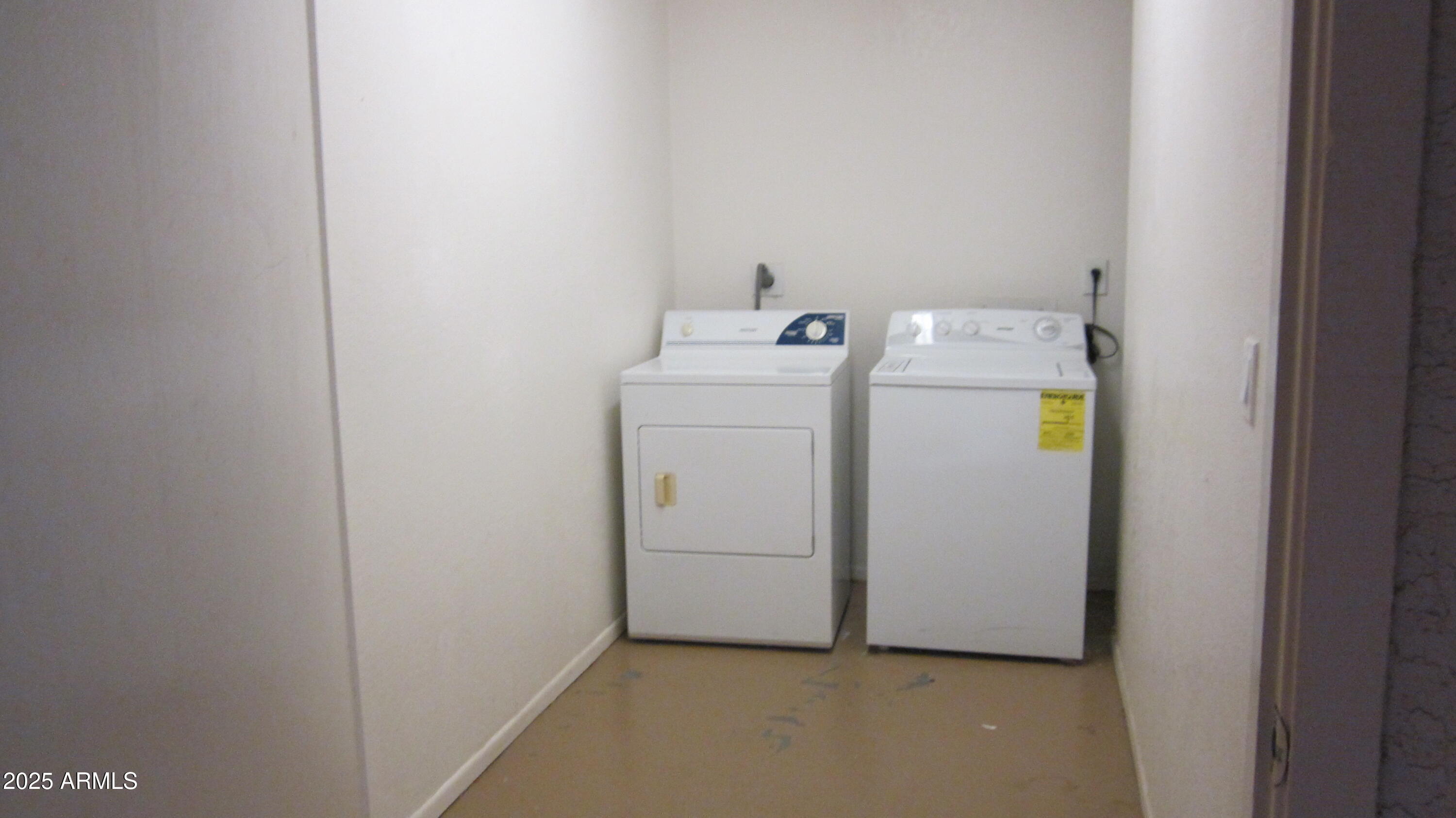 1340 North Recker Road, Unit 323 Mesa, AZ 85205 - Photo 4 of 13 a utility room with dryer and washer