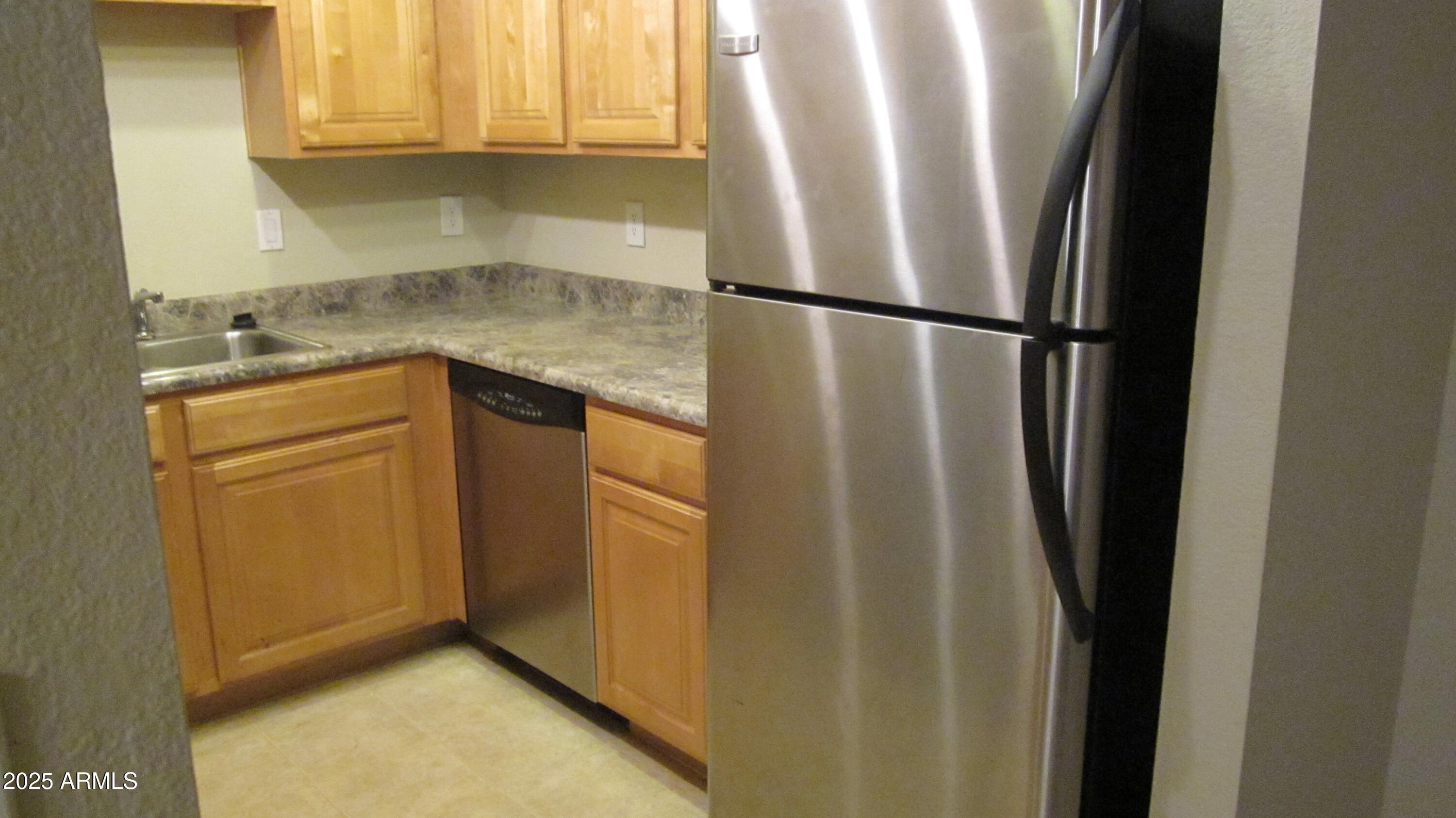 1340 North Recker Road, Unit 323 Mesa, AZ 85205 - Photo 9 of 13 a utility room with wooden floor washer and dryer