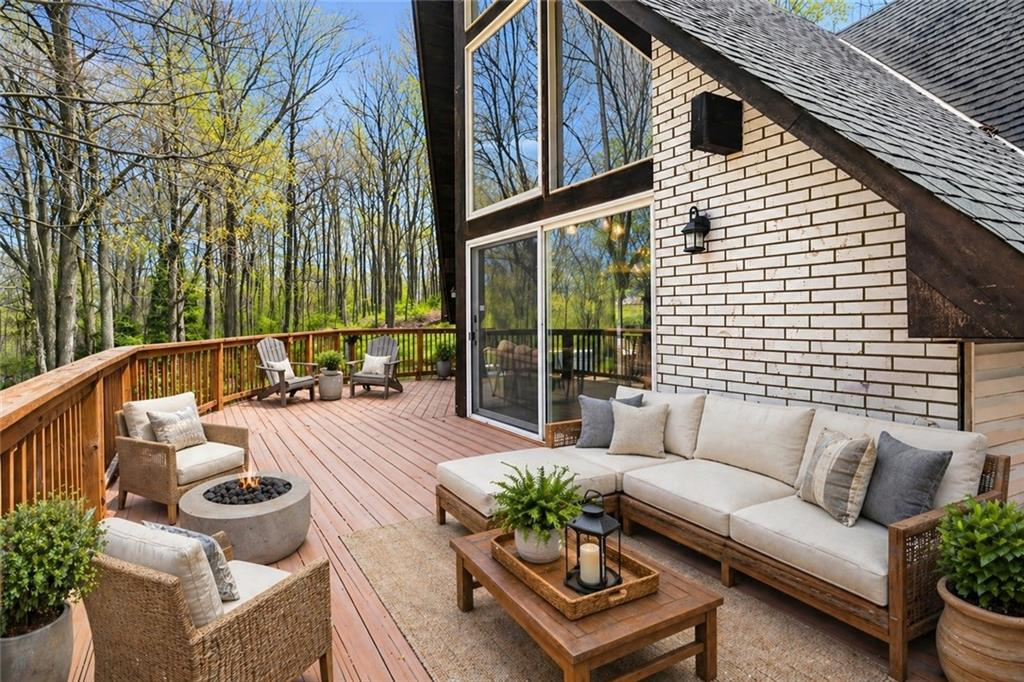 255 Claytonia Road Butler, PA 16001 - Photo 16 of 50 VIRTUALLY STAGED- Front portion of the wraparound deck, most accessible from the family room, creating a natural extension of your living space for relaxing, entertaining, and enjoying the outdoors.