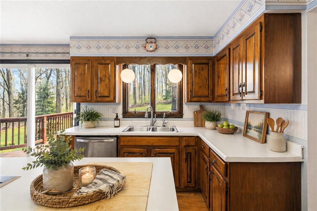 255 Claytonia Road Butler, PA 16001 - Photo 18 of 50 VIRTUALLY STAGED-Charming farmhouse-style eat-in kitchen with solid wood cabinetry, a center island, and a classic, inviting feel—imagine slow weekend mornings filled with the smell of coffee brewing and breakfast cooking as natural light pours in.