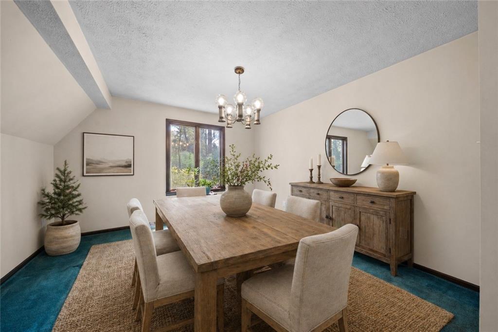 255 Claytonia Road Butler, PA 16001 - Photo 24 of 50 VIRTUALLY STAGED- Conveniently located off the kitchen, this dining space easily transitions into a home office, playroom, or flex space—ideal for staying connected while cooking or entertaining.