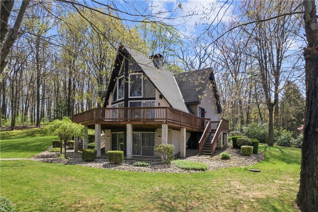255 Claytonia Road Butler, PA 16001 - Photo 3 of 50 This A-frame, chalet-style home makes an unforgettable first impression with its soaring wall of windows and connection to nature. Nestled among the trees, it feels peaceful and private—offering a serene backdrop whether you’re settling in full-time or escaping for the weekend