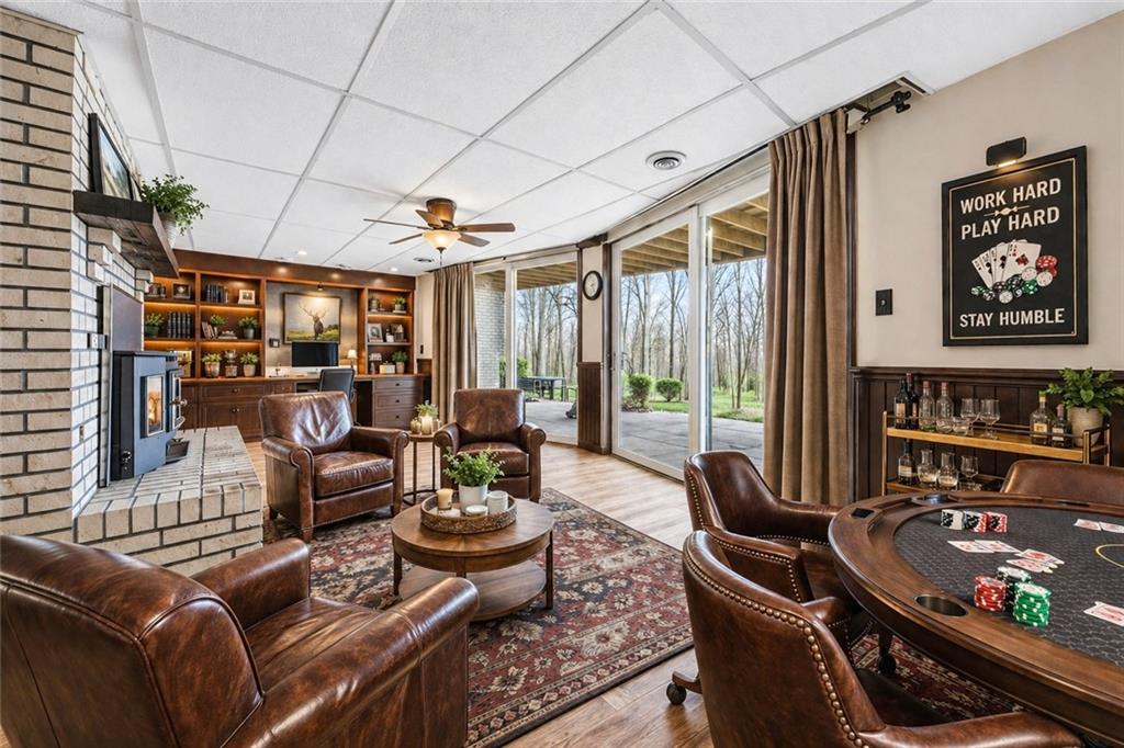 255 Claytonia Road Butler, PA 16001 - Photo 35 of 50 VIRTUALLY STAGED AND ENHANCED to highlight possibilities. Envision a custom built-in workspace seamlessly integrated into the existing shelving—offering a perfect blend of productivity and comfort in this versatile space.