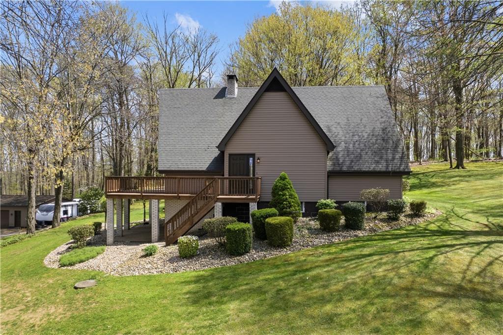 255 Claytonia Road Butler, PA 16001 - Photo 4 of 50 This A-frame, chalet-style home makes an unforgettable first impression with its soaring wall of windows and connection to nature. Nestled among the trees, it feels peaceful and private—offering a serene backdrop whether you’re settling in full-time or escaping for the weekend