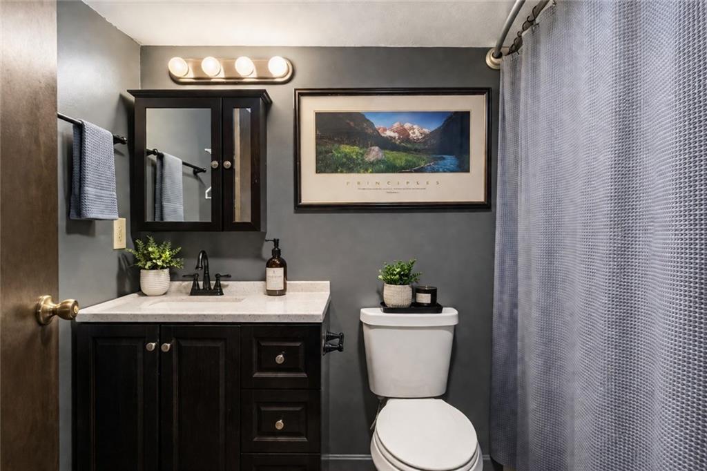255 Claytonia Road Butler, PA 16001 - Photo 45 of 50 VIRTUALLY STAGED-The updated lower level bathroom offers a fresh, modern feel with a sleek tub/shower combination, stylish vanity, and low-maintenance LVP flooring