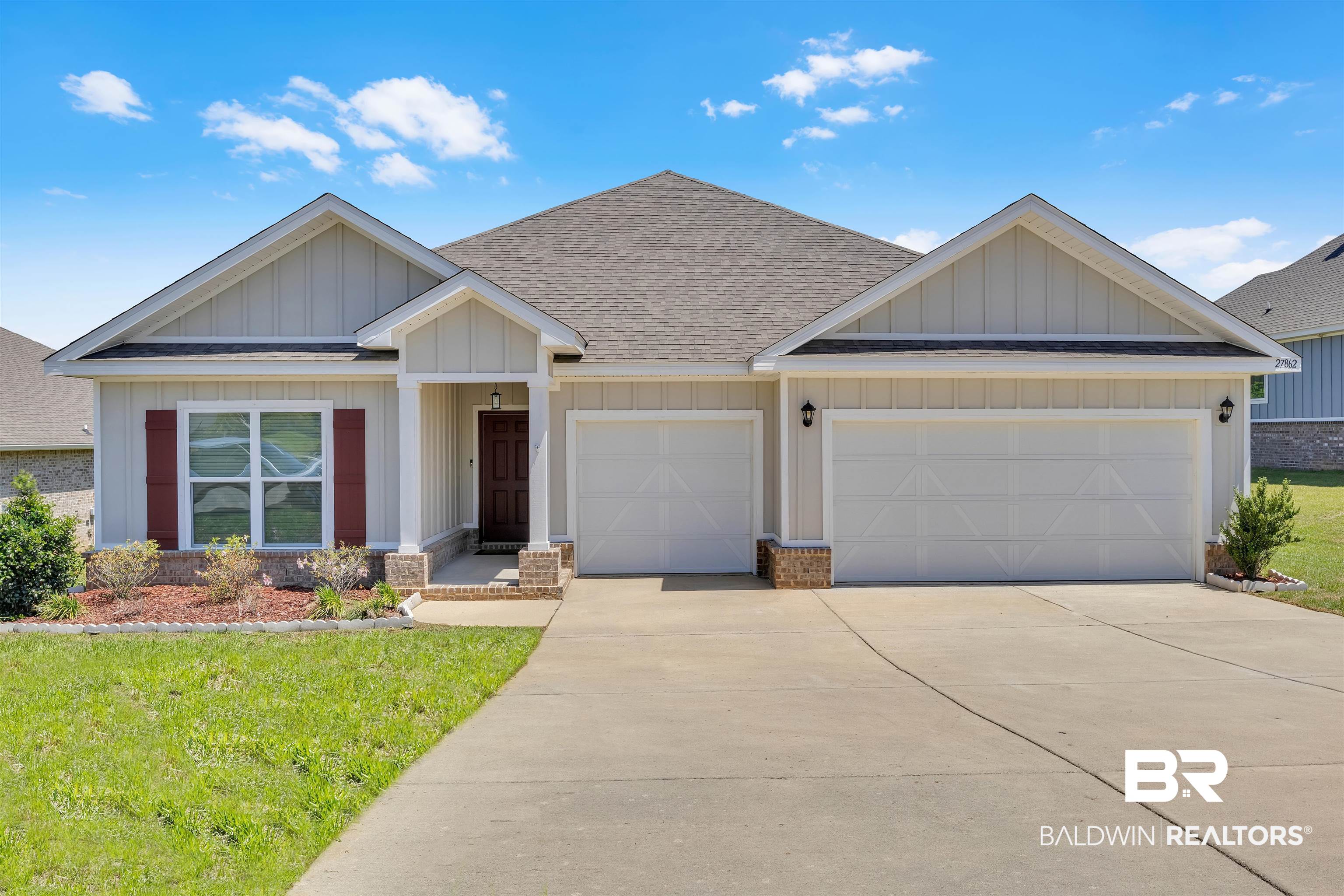 27862 Jade Court Daphne, AL 36526 - Photo 1 of 33 View of front of home featuring board and batten siding, an attached garage, roof with shingles, and driveway