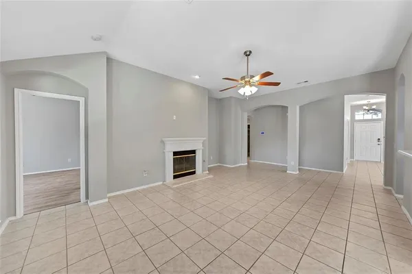 a view of an empty room with a fireplace