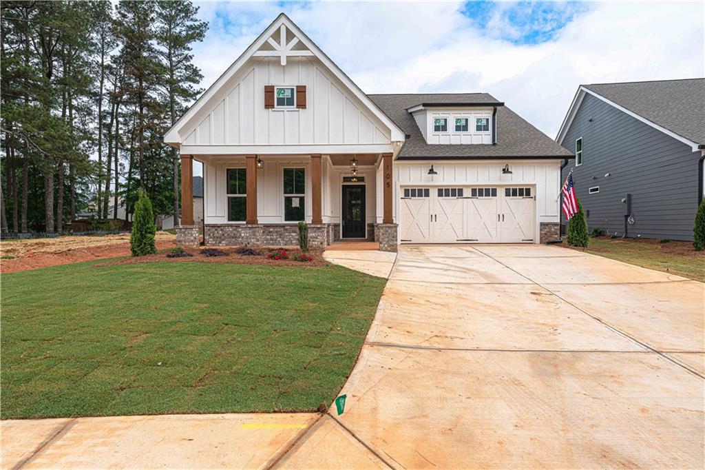 105 Alaina Road Canton, GA 30115 - Photo 1 of 1 a front view of a house with a garden and plants